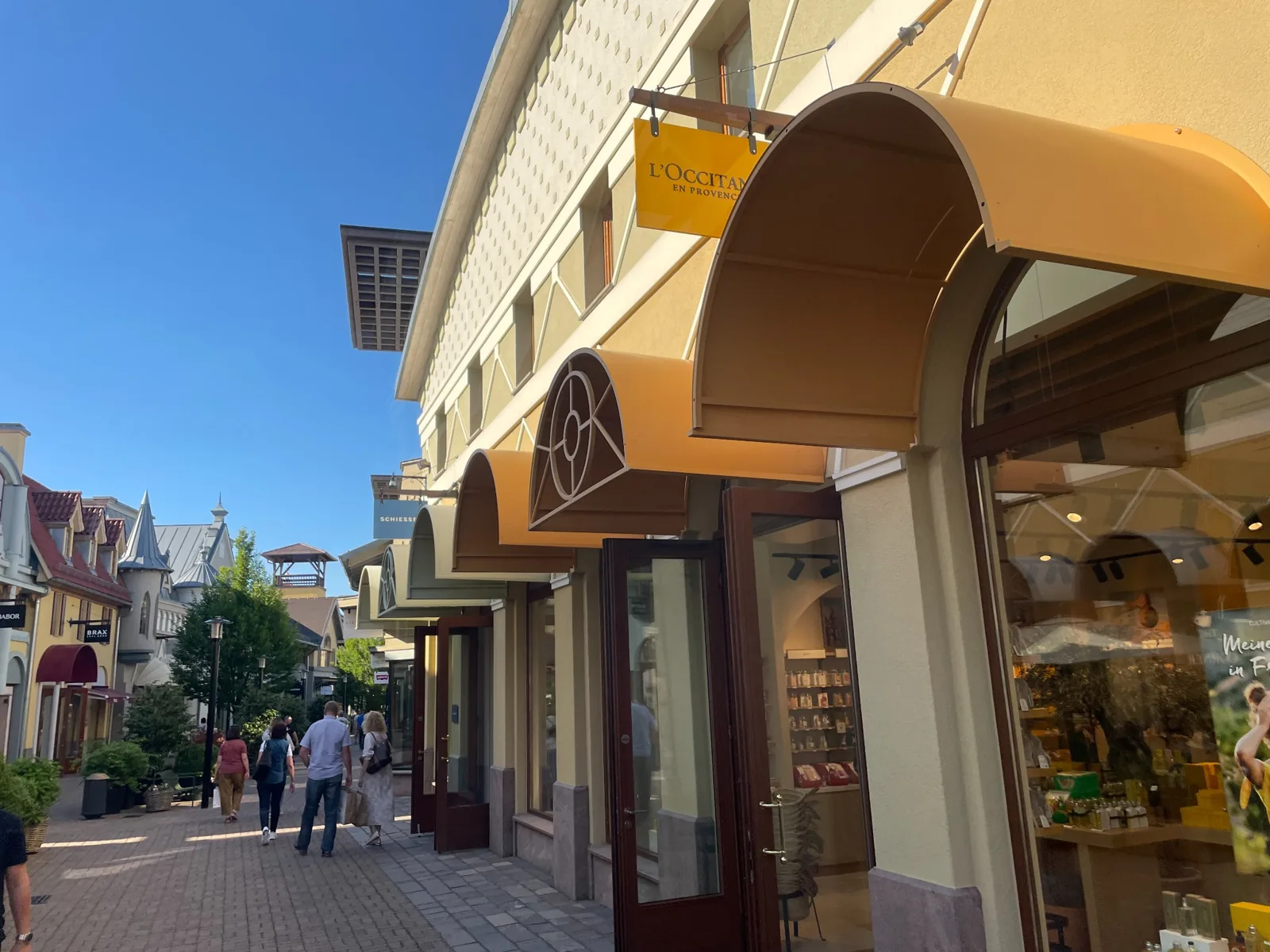 Outdoor boutique lane and colourful shopfronts at Wertheim Village